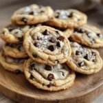 - 1 cup unsalted butter - 1 cup brown sugar, packed - 1/2 cup granulated sugar - 2 large eggs - 2 teaspoons vanilla extract - 3 cups all-purpose flour - 1 teaspoon baking soda - 1/2 teaspoon salt - 1 1/2 cups semi-sweet chocolate chips - Optional: Flaky sea salt for topping To make the best brown butter chocolate chip cookies, you need great ingredients. Each one plays a big role in the taste and texture of your cookies. The unsalted butter is vital. It gives the cookies a rich flavor. Brown sugar adds a warm, caramel note. Granulated sugar helps with the cookie's crispness. The two large eggs bind the dough together. They also help the cookies rise. Vanilla extract gives a lovely aroma and enhances the flavor. All-purpose flour is the main base. Baking soda helps the cookies rise and stay soft. Salt balances the sweetness. Finally, semi-sweet chocolate chips are a must. They bring a sweet bite to every cookie. If you want to add a sprinkle of flaky sea salt on top, it enhances the flavor even more. Gather these ingredients, and you'll be on your way to baking a cookie that everyone loves! To start, melt the butter in a medium saucepan over medium heat. Keep stirring constantly. You will see the butter begin to foam. Watch closely as it turns a deep golden brown. You will smell a nutty aroma that tells you it’s ready. Remove it from the heat and let it cool slightly. In a large mixing bowl, combine the brown butter, brown sugar, and granulated sugar. Whisk them until smooth and creamy. Next, add the eggs one at a time. Beat well after each egg. Then mix in the vanilla extract until it is fully combined. In another bowl, whisk together the flour, baking soda, and salt. Gradually add the dry mix to the wet mixture. Fold gently until just combined. Now stir in the semi-sweet chocolate chips. Chill the dough for 30 minutes to an hour. While it chills, preheat your oven to 350°F (175°C) and prepare two baking sheets with parchment paper. Once chilled, use a cookie scoop or tablespoon to portion the dough onto the prepared baking sheets. Leave about 2 inches between each cookie. If you like, lightly sprinkle them with flaky sea salt. Bake the cookies for 10-12 minutes. The edges should be golden, but the centers remain soft. After baking, let them cool on the sheets for 5 minutes before moving them to a wire rack. Chilling the dough is key. It helps the cookies hold their shape. If you skip this step, the cookies may spread too much. I recommend chilling for 30 minutes to an hour. Baking time can also change based on your oven. Some ovens run hot, while others are cooler. Start with 10 minutes. Check for golden edges and soft centers. You can add nuts like walnuts or pecans for crunch. They pair well with the chocolate. You can also try different chocolate types. Dark chocolate adds a rich flavor, while milk chocolate is sweeter. Using high-quality chocolate chips makes a big difference. They melt better and taste richer. Always choose chocolate that you love to eat straight from the bag. Serve the cookies on a nice platter. Stack them high for a tempting look. You can also sprinkle a few more chocolate chips on top. For a special touch, add flaky sea salt. It enhances the sweet flavor and looks beautiful. Enjoy the cookies warm for the best taste experience! {{image_2}} If you want a gluten-free option, you can still enjoy these cookies! Use almond flour or coconut flour instead of all-purpose flour. Almond flour gives a nice nutty taste. Coconut flour absorbs more moisture, so use less of it. When using coconut flour, try 1 cup and add an extra egg. This helps keep the dough from being too dry. You can switch up the chocolate in your cookies. Try dark chocolate chips for a richer flavor. They add a nice depth that pairs well with brown butter. If you prefer milk chocolate, that works too! It gives a sweeter taste. For a fun twist, add some white chocolate chips. The creaminess of white chocolate contrasts well with the brown butter flavor. Feel free to get creative with your cookies! You can add nuts like walnuts or pecans for a crunch. If you love caramel, chop some up and mix it in. Dried fruit like cranberries or cherries can also add a nice touch. Just remember to keep the mix-ins balanced so the cookies stay soft and chewy. To keep your cookies fresh, use air-tight containers. These containers lock in moisture. This keeps them soft and chewy. Cookie jars can be fun, but they may let air in. Air can dry out your cookies. Choose a container that seals tightly for best results. Freezing unbaked dough is a smart move! First, scoop the dough into balls. Place them on a baking sheet. Freeze the balls for about an hour. This step helps them hold their shape. Once frozen, transfer the dough balls to a freezer bag. They can last for up to three months. When you're ready to bake, just pop them in the oven. No need to thaw! Baked cookies can last for about a week at room temperature. Store them in an air-tight container. If you need them to last longer, use the fridge. They can stay fresh for about two weeks there. Just remember, the fridge can make them a bit firmer. If you prefer a soft cookie, enjoy them at room temperature! You can use salted butter, but it changes the taste. Salted butter may add too much salt to your cookies. If you choose to use it, reduce the added salt in the recipe. This helps balance the flavors. Unsalted butter is best for baking as you control the salt level. Cookies can spread too much for a few reasons. Using too much butter or not chilling the dough can cause this. Make sure you measure your butter correctly. Chilling the dough for at least 30 minutes helps firm it up. If you see spreading, try adding a bit more flour to the dough. Look for golden edges and soft centers. The cookies will look slightly underbaked in the middle. They will continue to cook on the baking sheet after you take them out. For best results, let them cool for a few minutes before moving them. You can use white sugar or coconut sugar instead of brown sugar. White sugar makes cookies crisper and less chewy. Coconut sugar adds a hint of caramel flavor but may change the texture. If you swap sugars, keep an eye on the baking time and dough consistency. Making brown butter chocolate chip cookies is fun and rewarding. You learned about key ingredients and step-by-step instructions for perfect cookies. Chilling the dough is essential, and you have tips for flavor and presentation. Variations, like gluten-free options, let you customize your treat. Proper storage ensures your cookies stay fresh. Enjoy baking these cookies and share them with friends. The warmth of fresh cookies brings joy to any occasion. Happy baking!