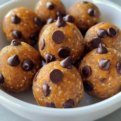 To make these tasty Pumpkin Chocolate Chip Energy Balls, you will need: - 1 cup pumpkin puree - 1 cup rolled oats - 1/2 cup almond butter (or any nut butter) - 1/4 cup honey or maple syrup - 1/2 teaspoon vanilla extract - 1 teaspoon pumpkin pie spice - 1/4 teaspoon salt - 1/2 cup mini chocolate chips - 1/4 cup chopped nuts (walnuts or pecans) optional If you want to switch things up, here are some great options: - Use sunflower seed butter instead of almond butter for a nut-free version. - Swap honey for agave syrup or maple syrup for a vegan option. - Try using quick oats if you don't have rolled oats. - For a fun twist, add dried cranberries or raisins for extra sweetness. Each energy ball is packed with nutrients. Here’s what you get per serving: - Calories: 120 - Protein: 3g - Fat: 5g - Carbohydrates: 16g - Fiber: 2g - Sugars: 5g These energy balls are a healthy snack choice. They provide a good balance of protein, carbs, and healthy fats. 1. Start with a large mixing bowl. Add 1 cup of pumpkin puree. 2. Then, add 1 cup of almond butter. You can use any nut butter you like. 3. Next, pour in 1/4 cup of honey or maple syrup. This adds sweetness. 4. Add 1/2 teaspoon of vanilla extract for flavor. Mix until smooth and blended. 5. In another bowl, whisk together 1 cup of rolled oats, 1 teaspoon of pumpkin pie spice, and 1/4 teaspoon of salt. 6. Gradually add the dry mix to the wet mix. Stir until all is well combined. 7. Now, fold in 1/2 cup of mini chocolate chips. If you like nuts, add 1/4 cup of chopped walnuts or pecans. - Make sure to chill the energy balls for at least 30 minutes. This helps them firm up. - Use a tablespoon to scoop the mixture for even-sized balls. - If the mixture is too sticky, wet your hands to make rolling easier. - You can add more spice if you want a stronger flavor. - Step 1: Bowl with pumpkin puree. - Step 2: Bowl filled with almond butter. - Step 3: Honey or maple syrup being poured in. - Step 4: Mixing all wet ingredients together. - Step 5: Bowl with dry ingredients whisked together. - Step 6: Mixing dry into wet, creating a dough. - Step 7: Folding in chocolate chips and nuts. - Final Step: Energy balls arranged on a parchment-lined sheet. This guide helps you make delicious Pumpkin Chocolate Chip Energy Balls with ease! Store your Pumpkin Chocolate Chip Energy Balls in an airtight container. They last up to one week in the fridge. For longer storage, freeze them. Just place them in a freezer-safe bag, and they can last up to three months. These energy balls are perfect for a quick snack. You can enjoy them after a workout or with your morning coffee. For added flair, serve them on a platter with fresh fruit or yogurt. You can also create a fun snack mix by adding seeds or dried fruit. Avoid overmixing the dough. If you mix too much, the texture can become tough. Make sure to use real pumpkin puree, not pumpkin pie filling. The filling has added sugars and spices that can change the taste. Lastly, don’t skip chilling the energy balls; this helps them hold their shape. {{image_2}} You can change the taste of your energy balls easily. Add spices like cinnamon or nutmeg for a warm touch. You can also mix in dried fruits such as cranberries or raisins for sweetness. Another idea is to use toasted coconut for a tropical twist. Each option will give your energy balls a fun new flavor. If you have allergies, you can still enjoy these energy balls. Use sunflower seed butter instead of almond butter to keep it nut-free. For a vegan option, replace honey with maple syrup. Always check labels when buying ingredients to ensure they meet your dietary needs. This way, everyone can enjoy these tasty snacks. You can make energy balls fit any season. For fall, add chopped apples and extra cinnamon for a cozy vibe. In winter, mix in peppermint extract for a festive twist. During summer, consider using fresh berries for a fruity flavor. These tweaks make your energy balls special for any holiday or event. Pumpkin Chocolate Chip Energy Balls last about one week. Store them in an airtight container. Keep them in the fridge for the best taste. They may dry out at room temperature after a few days. Yes, you can freeze these energy balls. Place them in a freezer-safe bag or container. They can last up to three months in the freezer. When you want one, just take it out and thaw it in the fridge. You can use peanut butter or sunflower seed butter instead of almond butter. Both options work well in this recipe. They will add a nice flavor and keep the balls moist. If you have nut allergies, sunflower seed butter is a great choice. If you love these Pumpkin Chocolate Chip Energy Balls, you might enjoy these recipes: - Peanut Butter Energy Balls: A classic with a rich nutty taste. - Coconut Almond Energy Bites: A tropical twist with coconut flakes and almonds. - Chocolate Date Energy Balls: Sweet and chewy, perfect for a quick treat. These recipes are easy to make and packed with energy! Each ingredient in these energy balls has its own health perks: - Pumpkin puree: Full of vitamins A and C, great for your skin. - Rolled oats: Rich in fiber, they help keep you full and boost digestion. - Almond butter: Packed with healthy fats and protein for energy. - Honey or maple syrup: Natural sweeteners that add flavor without refined sugar. - Pumpkin pie spice: Contains cinnamon and nutmeg, which may help with inflammation. These ingredients work together to create a nutritious snack! For a fun visual guide, check out this (#) on making Pumpkin Chocolate Chip Energy Balls. Watching the process can help you get the steps just right! In this post, we explored the ingredients, steps, and tips for making energy balls. You learned about alternatives for dietary needs and common mistakes to avoid. Understanding storage and serving ideas will help you enjoy them longer. I shared tasty variations to keep things fun. Use the FAQs for quick answers. Now, you are ready to make your own healthy snacks. Enjoy the process and get creative!